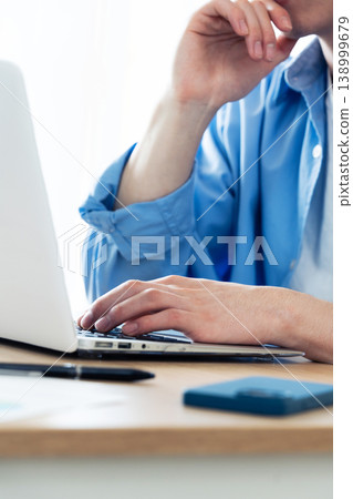 Hand of a man working on a computer Hand of a man working on a computer 138999679