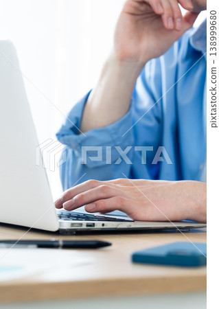 Hand of a man working on a computer Hand of a man working on a computer 138999680