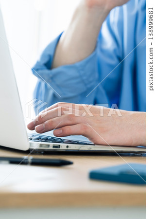 Hand of a man working on a computer Hand of a man working on a computer 138999681
