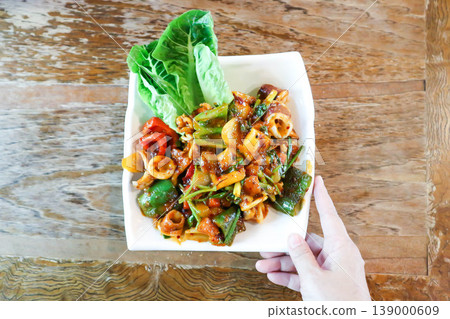 stir fried squid or stir fried spicy squid with sweet pepper and onion or spicy squid stir fried squid or stir fried spicy squid with sweet pepper and onion or spicy squid 139000609