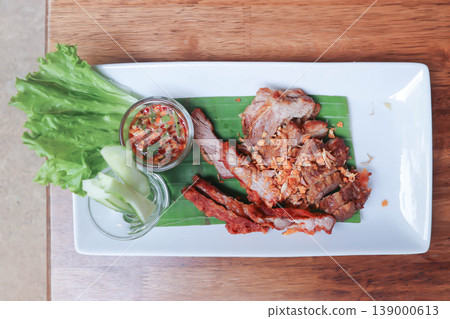 fried pork or deep fried pork with fried garlic and vegetable fried pork or deep fried pork with fried garlic and vegetable 139000613