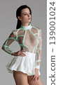 Woman fashion futuristic bodysuit neon portrait model studio transparent mesh futuristic fashion portrait studio model wearing transparent mesh bodysuit with neon lines and white skirt 139001024
