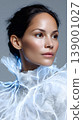 Portrait woman beauty fashion white ruffle collar tulle studio portrait of woman with elegant white ruffle tulle collar, glowing light accent, clean skin and minimal makeup, looking away with calm 139001027