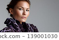 Fashion portrait woman studio beauty black clothing elegant closeup hairstyle neutral background makeup Fashion portrait of woman studio closeup, wearing black clothing with glowing pattern 139001030