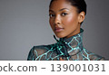 Portrait woman beauty fashion makeup studio elegant glowing model neckline Modern studio portrait featuring elegant woman with glowing makeup wearing sheer patterned fashion top, calm confident 139001031