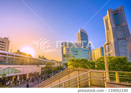 New cityscape of Yokohama, Japan, April 18th. A view of Sakuragicho Station, Yokohama Landmark Tower, and trains illuminated by the setting sun. New cityscape of Yokohama, Japan, April 18th. A view of Sakuragicho Station, Yokohama Landmark Tower, and trains illuminated by the setting sun. 139002290