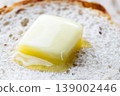 The scene of butter melting on bread. 139002446