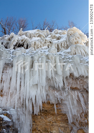 Icicles on the rocks 139002478