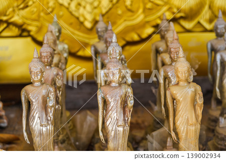Golden Buddha Figurines Arranged In Rows Inside Thai Temple Shrine Golden Buddha Figurines Arranged In Rows Inside Thai Temple Shrine 139002934