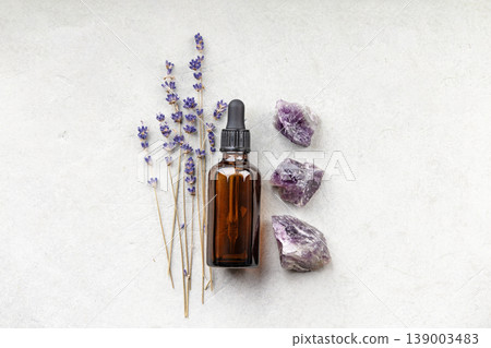 Lavender and Amethyst with Essential Oil Bottle on Neutral Background 139003483
