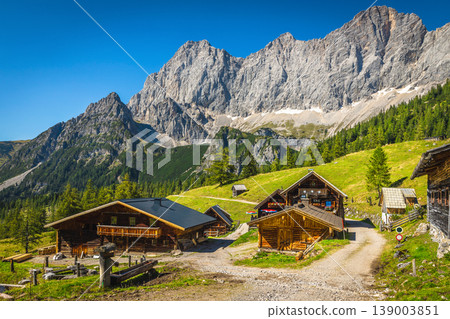 Scattered alpine chalets on the meadow, Ramsau am Dachstein, Austria 139003851