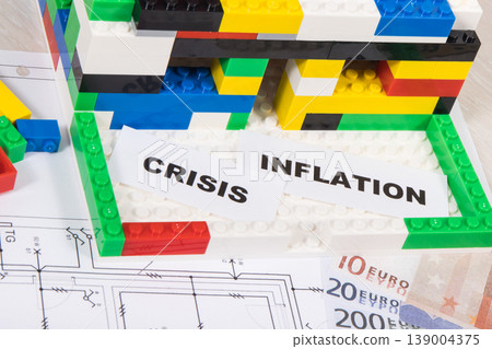 House under construction made of toy blocks, money, housing plan, inscription crisis and inflation 139004375