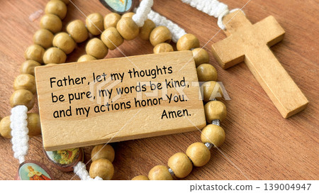 Father, if it be possible, let this cup pass from me. Amen, Wooden prayer plaque with rosary beads and cross representing surrender to God during hardship. Father, if it be possible, let this cup pass from me. Amen, Wooden prayer plaque with rosary beads and cross representing surrender to God during hardship. 139004947