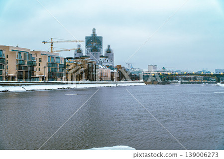 Snowy riverfront scene showing a winter city skyline 139006273