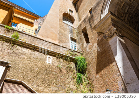 Vatican street old houses architecture St. Peter's Church exterior. Old wall facade details. 139006350