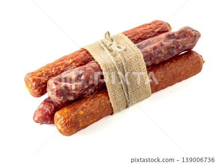 Dry cured sausages isolated on white. Dry cured sausages isolated on white. 139006736