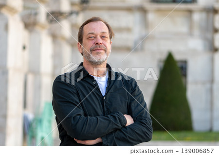 Mature man portrait in city with business style and expression of confidence and control 139006857
