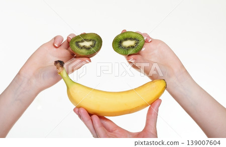 woman hand with kiwi fruit isolated 139007604
