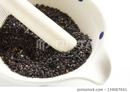 Black sesame seeds in a mortar Black sesame seeds in a mortar 139007681