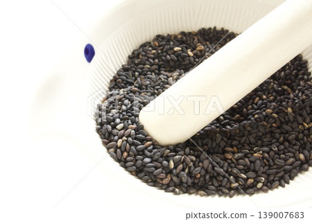 Black sesame seeds in a mortar Black sesame seeds in a mortar 139007683