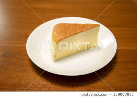 A single slice of soufflé cheesecake on a plate 139007933