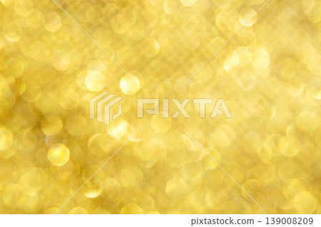 Soft gold bokeh background with warm sparkling glitter and festive light highlights Soft gold bokeh background with warm sparkling glitter and festive light highlights 139008209