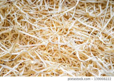 Natural wood wool and wood shavings texture for packaging, crafts and decoration Natural wood wool and wood shavings texture for packaging, crafts and decoration 139008222