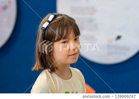 Child portrait shows calm attention and natural behavior in home environment Child portrait shows calm attention and natural behavior in home environment 139009287