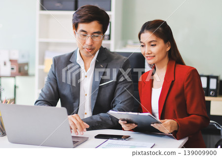 Group of business people and software developers working as a team in office Group of business people and software developers working as a team in office 139009900