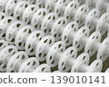 White plastic rollers of industrial conveyor, production, sorting, or transportation line 139010141