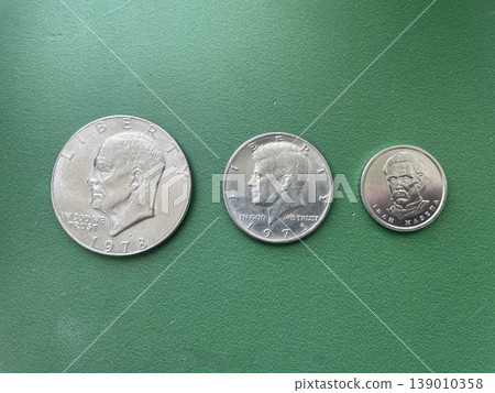 Eisenhower dollar coin compared with kennedy half and ukrainian hryvnia Eisenhower dollar coin compared with kennedy half and ukrainian hryvnia 139010358