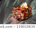 Grilled beef steak with herbs and butter on aluminum foil background 139010630