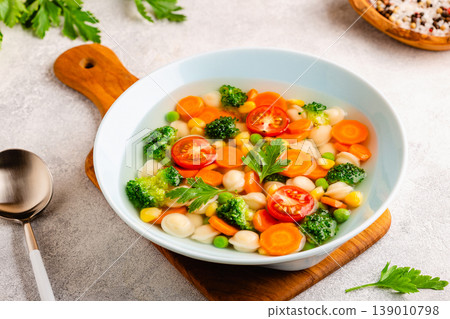 Soup with mini dumplings and vegetables. 139010798