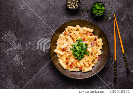 Spicy Rice Cake with Cheese and Bacon or Cream Teokbokki, Tteokbokki. Spicy Rice Cake with Cheese and Bacon or Cream Teokbokki, Tteokbokki. 139010801