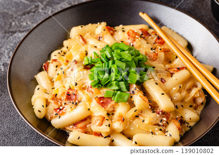 Spicy Rice Cake with Cheese and Bacon or Cream Teokbokki, Tteokbokki. Spicy Rice Cake with Cheese and Bacon or Cream Teokbokki, Tteokbokki. 139010802