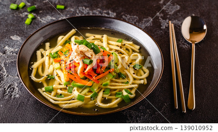 Traditional Korean chicken soup with homemade noodles 139010952