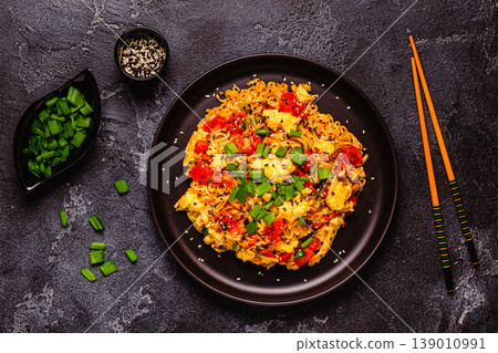 Korean style instant noodle, Shin Ramyeon with tomatoes and scrambled eggs. 139010991