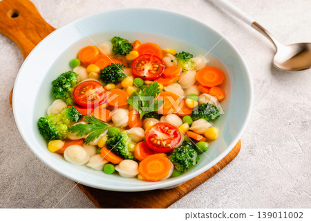 Soup with mini dumplings and vegetables. 139011002