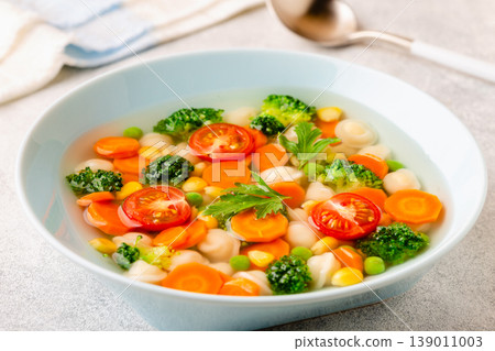 Soup with mini dumplings and vegetables. 139011003