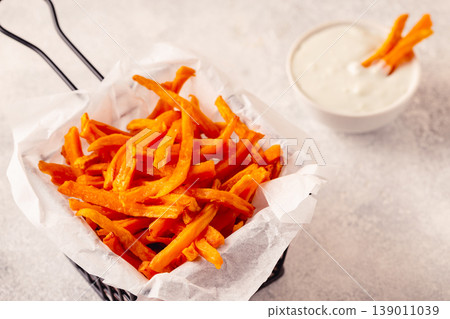 Sweet potato fries with blue cheese sauce. Sweet potato fries with blue cheese sauce. 139011039
