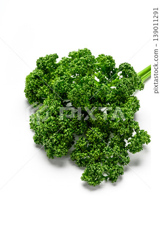 A white background image of vibrant green parsley. A white background image of vibrant green parsley. 139011291
