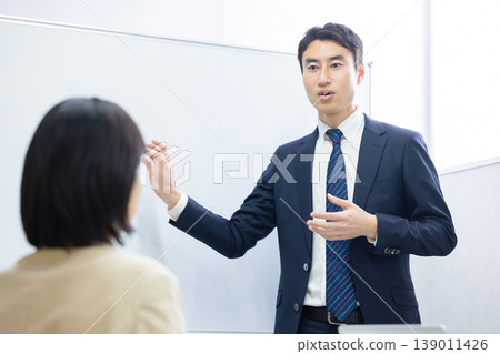 A man giving a presentation 139011426