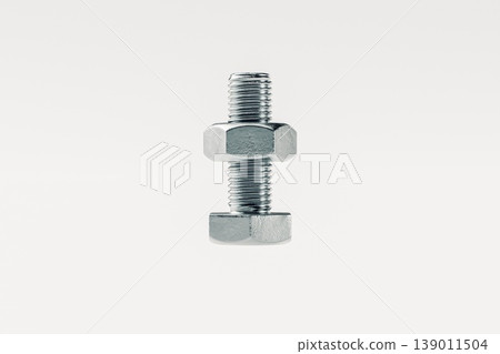 Close-Up of Metal Bolt and Nut on White Background 139011504