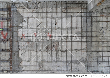 Wall made of limestone and rebar mesh. Wall made of limestone and rebar mesh. 139011524