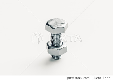 Close-Up of a Silver Bolt and Nut on a Light Background Close-Up of a Silver Bolt and Nut on a Light Background 139011566
