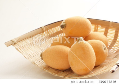 Loquats in a colander Loquats in a colander 139011816