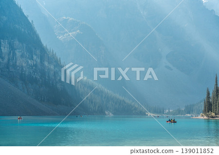 People enjoying canoeing on Moraine Lake People enjoying canoeing on Moraine Lake 139011852