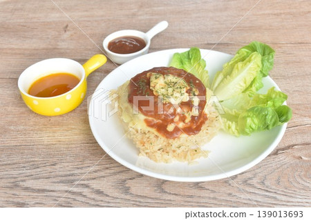 fried pork Hamburg steak topping fried rice butter with cos lettuce on plate dipping sauce fried pork Hamburg steak topping fried rice butter with cos lettuce on plate dipping sauce 139013693