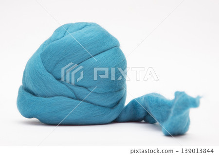 A skein of colored merino wool on a white background A skein of colored merino wool on a white background 139013844