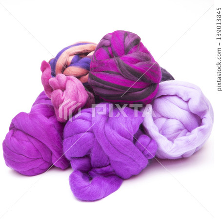 Multicolored skeins of merino wool on a white background 139013845